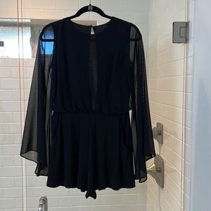 Black Topshop romper with sheer long sleeves